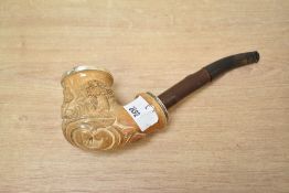 A white metal mounted Meerschaum pipe, having a carved country scene and scrollwork and white
