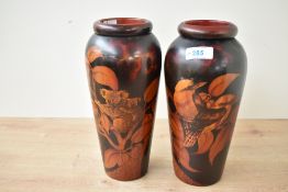 Two early to mid 20th-century Australian turned hardwood pokerwork vases, of baluster form,