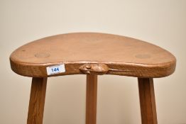 A 20th-century Robert 'Mouseman' Thompson (1876-1955) of Kilburn oak three-legged stool, having a
