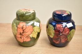 Two 20th-century Moorcroft Pottery 'Hibiscus' decorative ginger jars, to feature two colour