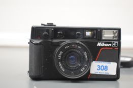 A Nikon L35 AF 35mm Compact camera in original makers case