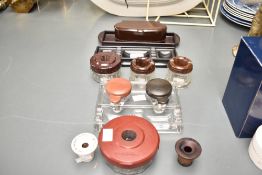 A quantity of 20th-century bakelite desk accessories, to feature two Iridinoid glass based