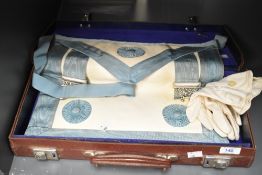 A 20th-century Masonic Master Mason leather apron with cream gloves, accompanied by a 'Grand Master'
