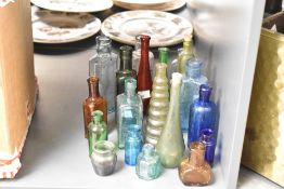 A selection of late 19th to early 20th-century coloured glass ware, to feature blue, amber, green