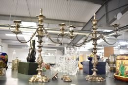 Two large 19th-century silver-plate candelabra, featuring floral and foliate detailing with two