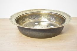 A large 20th-century Middle Eastern-style brass charger, having repetitive floral ad foliate