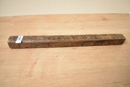 A 20th-century Chinese handcarved 'tianpeng ruler', having four-sides of carved Chinese characters