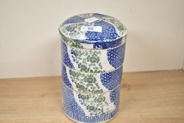 A 20th-century Japanese porcelain stackable bowl set, featuring three compartments of blue, green