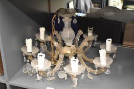 A large 20th-century French brass and glass 8-light pendant chandelier, having characteristics of