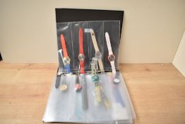 A collection of twenty-four novelty wristwatches, including advertisement pieces including 'The