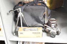 An Olympus OM-1 SLR camera with OM-Systam F Zuiko Auto S 1:1,8 50mm lens and Sunagor 70-305mm 1:5,