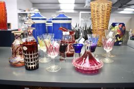 A selection of late 19th to early 20th-century coloured glassware, to feature two Bohemian-style