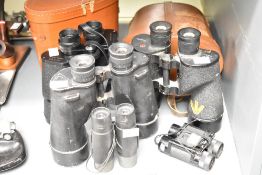Five pairs of binoculars. A pair of Bausch & Lomb 7x50 with miltary crowsfoot mark, a pair of REL