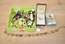 A small assortment of costume jewellery, including beaded jewellery, brooches and a bangle