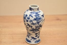 A Chinese blue and white porcelain prunus vase, presumed Kangxi period, of ovoid form with short