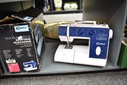 A vintage Delta 130 plastic sewing machine, with original box, 35cm in length, condition is