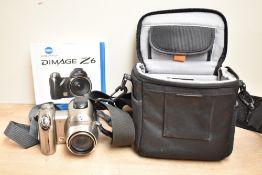 A Konica Minolta Dimage Z6 digital camera in a soft camera bag with instruction booklet