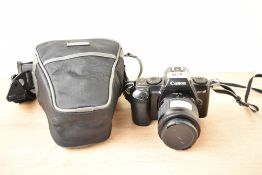 A Canon EF-M camera with Canon 35-80mm in Hama camera bag