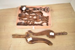 A quantity of 20th-century Welsh wooden love spoons, featuring a selection of ornate hand carved