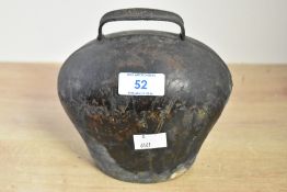 A 20th-century iron cow bell, having a bulbous shape and welded hook atop, unmarked, 15cm in height,