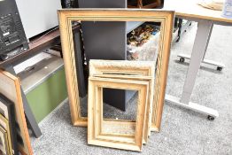 Four 20th-century gilt and wood frames, no glass, largest is 94cm x 74cm and smallest is 51cm x