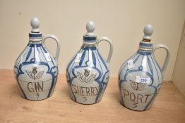 Three mid to late 20th-century Scottish Buchan Pottery stoneware flagons, featuring blue and white