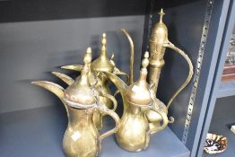A selection of late 19th-century to early 20th-century Middle Eastern brass Dallah-style coffee