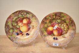 Two 20th-century Royal Worcester bone china cabinet plates, hand painted after John Freeman (b. 1911