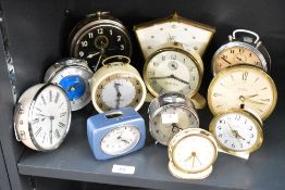 A large quantity of early to mid 20th-century mechanical alarm and mantel clocks, to feature