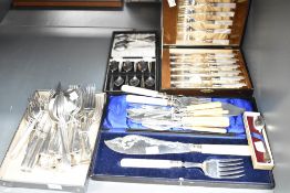A large selection of 20th-century silver-plate and metal cutlery, to feature a fine set of H