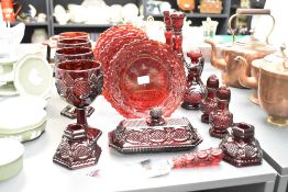 A selection of late 20th-century Avon 1876 Cape Cod pressed ruby red glassware, featuring embossed