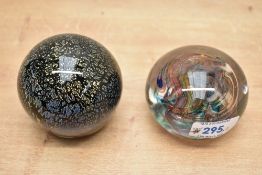 Two 20th-century studio art glass paperweights, to include a Wedgwood colourful abstract swirl