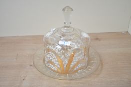 A Victorian glass cheese/butter dome, featuring delicate hand painted lily of the valley floral
