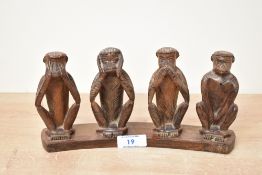 A late 20th-century hand carved wooden 'Four Monkeys' sculpture, depicting the 'see no evil, hear no
