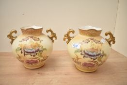 Two Victorian S. Fielding and Company pottery baluster vases with double gilded handles, renamed