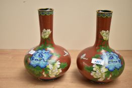 Two 20th-century Chinese cloisonne mantel vases, featuring floral and foliate motifs, having a
