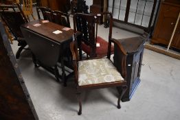 A 20th century mahogany carver armchair, having a concave top rail over a tapering and pierced