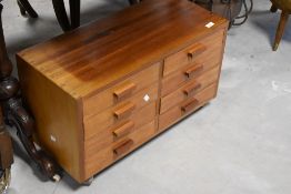 A vintage teak specimen/collectors chest of 8 drawers (some with dividers) on shepherds castors,