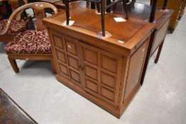 An Oriental hardwood buffet style cabinet in the Chinese style, having fold out top, dimensions