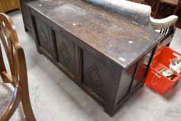 A period oak kist having three front panels with diamond carving, dimensions approx. W135 D56 H66cm