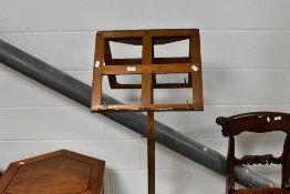 A 19th century oak, brass and cast iron pedestal duet music stand, the opposing rests over the