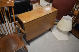 A vintage teak G plan gateleg table , having whale tail type supports, width approx. 91cm, opening
