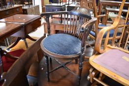A late 19th Century or early 20th Century mahogany corner bedroom armchair having inlaid