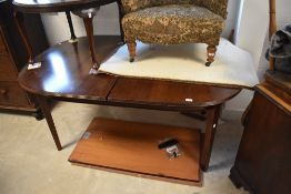 A modern mahogany oval extending dining table, by Bath cabinet makers, approx 105 x 162cm, plus