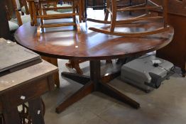 A vintage mahogany dining table, diameter approx 153cm, originally purchased in Cape Town