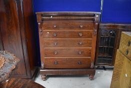 A 19th Century Scotch style chest of one concealed over five long drawers, having turned handles