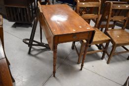 An early 20th century mahogany pembroke table, of rectangular form with rounded oblong flaps, over a