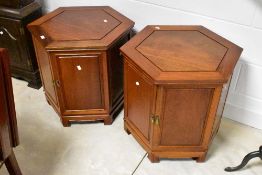 A pair of Oriental hardwood low cabinets having hexagonal tops, diameter approx. 57cm
