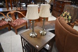 A pair of modern table lamps, on Corinthian style columns, includes shades and bulbs