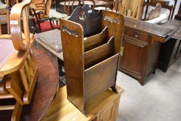 An early 20th Century oak three tier magazine rack, width approx. 40cm